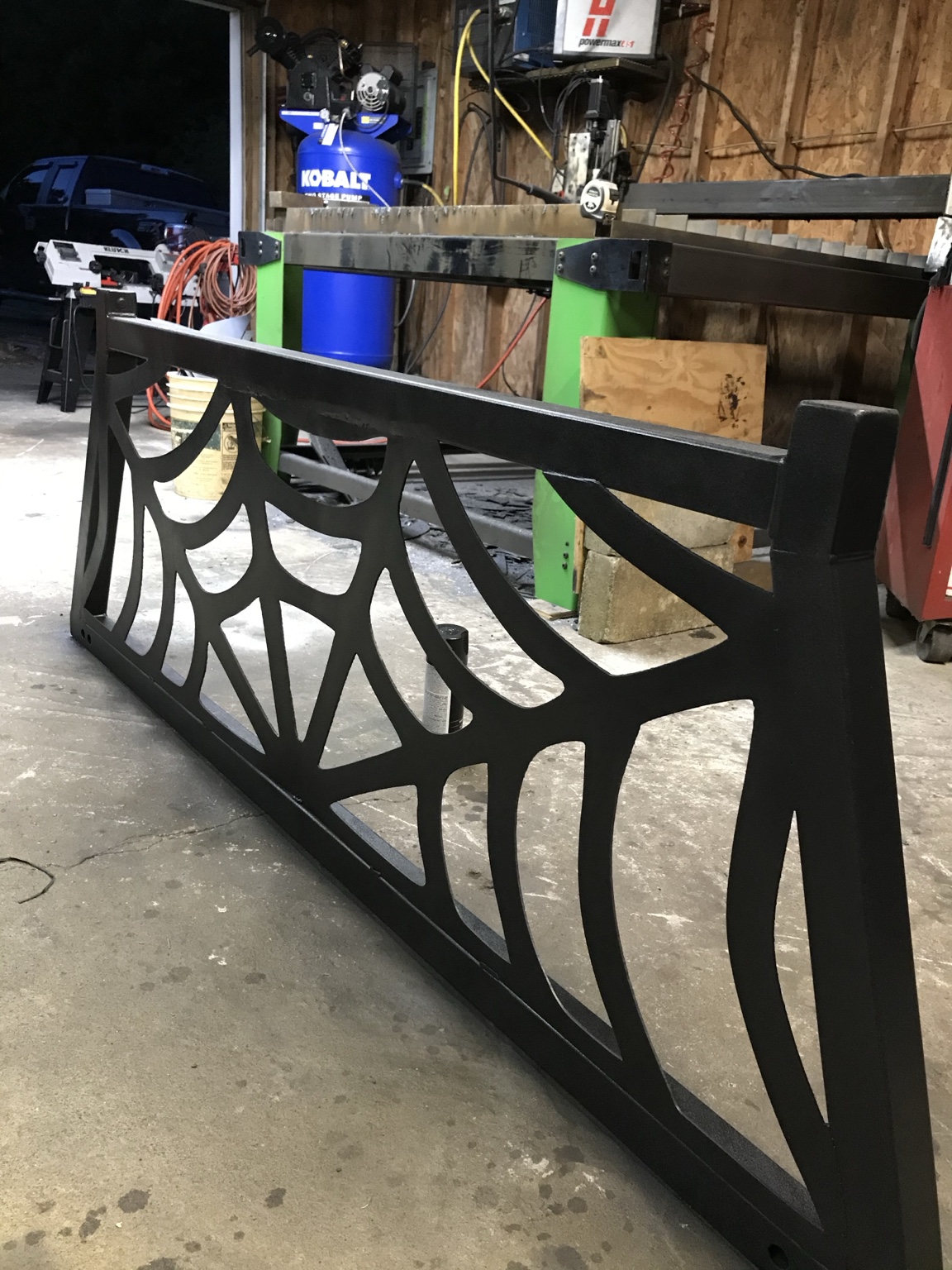 A custom headache rack with a geometric web pattern.